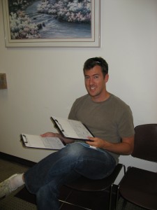 Travel Clinic Scott looking over our paperwork at the Long Beach Travel Clinic